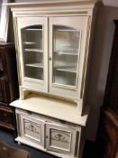 A 19th century painted glazed double door bookcase fitted with cupboards and drawer beneath.