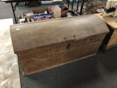 A 19th century oak dome topped shipping trunk with key.