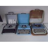 A box containing vintage typewriters.