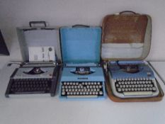 A box containing vintage typewriters.