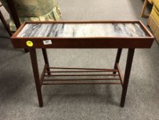 A mid century teak low side table with marble inset panel and under shelf,