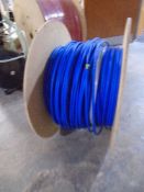 A spool of blue Excel fibre optic cable.
