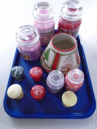 A tray of Yankee candles and candle shade