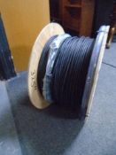 A spool of black fibre optic cable.