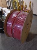 A spool of red fibre optic cable.