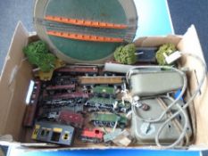 A box containing model train locomotives by Hornby and others, control units, model trees etc.