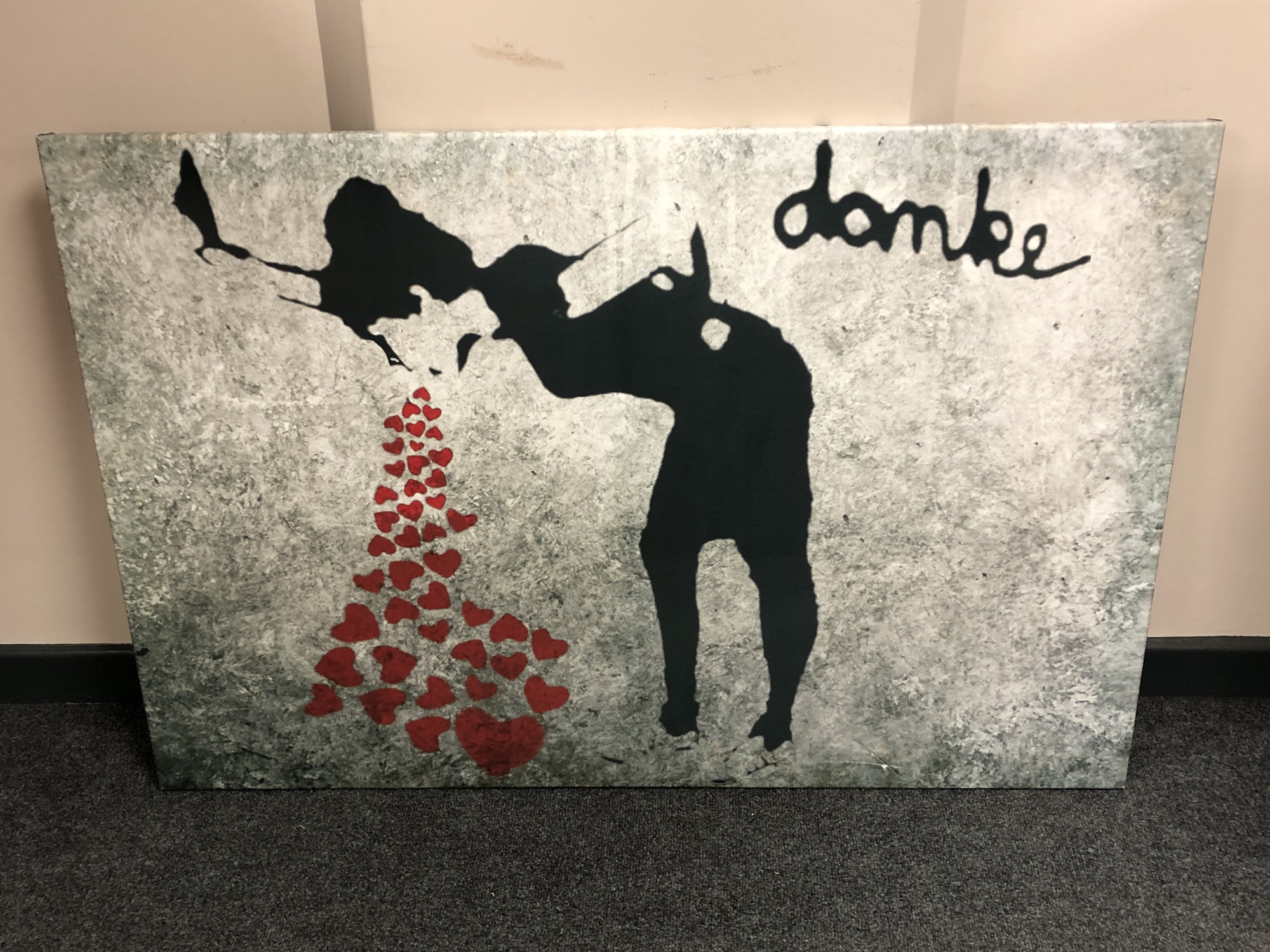 A canvas print after Banksy : Love Sick, 120cm by 80cm.