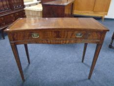 A Chapmans Siesta concave two drawer hall table on raised legs.