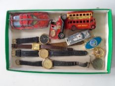 A small quantity of die cast model vehicles, gent's watches,