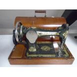 A Singer sewing machine in case.