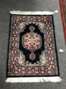 An Iranian fringed rug,