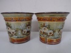 A pair of Royal Doulton glazed stoneware pots