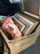 A box of pictures and prints, metal Bovril sign, Quaker Oats sign.