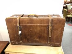A vintage hand stitched brown leather luggage case