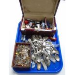 A lacquered box containing wrist watches, cutlery,