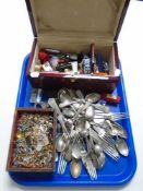 A lacquered box containing wrist watches, cutlery,