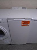 A Hotpoint slimline 7 kilogram top loading washing machine