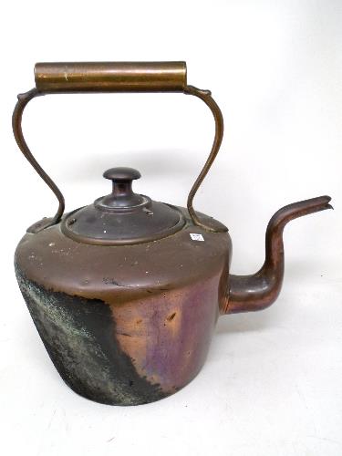 A Victorian copper kettle.