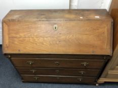 A 19th century continental oak writing bureau fitted with three drawers.