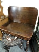 A 19th century mahogany turnover top tea table.