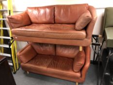 A pair of Scandinavian Dux leather upholstered settees (two feet missing)