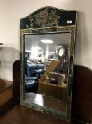 A Japanese green lacquered framed wall mirror.