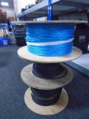 Two spools of fibre optic cabling and further spool of rope