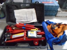 A Hilka five piece trolley jack set together with a further bag containing ratchet straps.