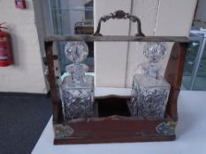 A mahogany and silver plated tantalus with two decanters no key CONDITION REPORT: