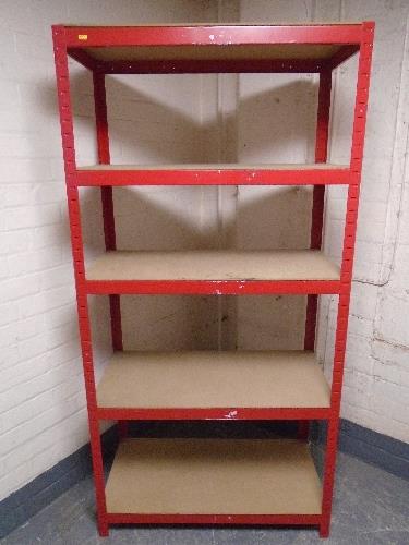 A five tier red metal shelving unit.