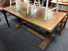 An oak refectory library table fitted a drawer,
