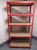 A five tier red metal shelving unit.