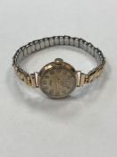 An early 20th century lady's Accurist wrist watch 9ct gold front and back on expansion bracelet.