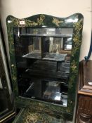 A Japanese green lacquered curio cabinet.