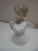 A small Lladro figure of an angel