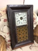 A 19th century American wall clock in painted case