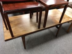 A mid century Danish teak adjustable coffee table,