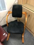 A 20th century Actulum ergonomic arm rocking chair