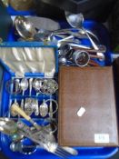 A tray containing assorted plated and stainless steel cutlery,