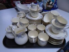 A tray containing a Royal Doulton Juliet bone china tea and coffee service.