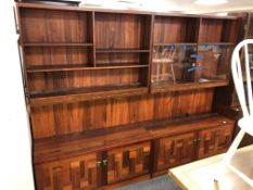 A mid century Danish rosewood twin section bookcase fitted with cupboards,