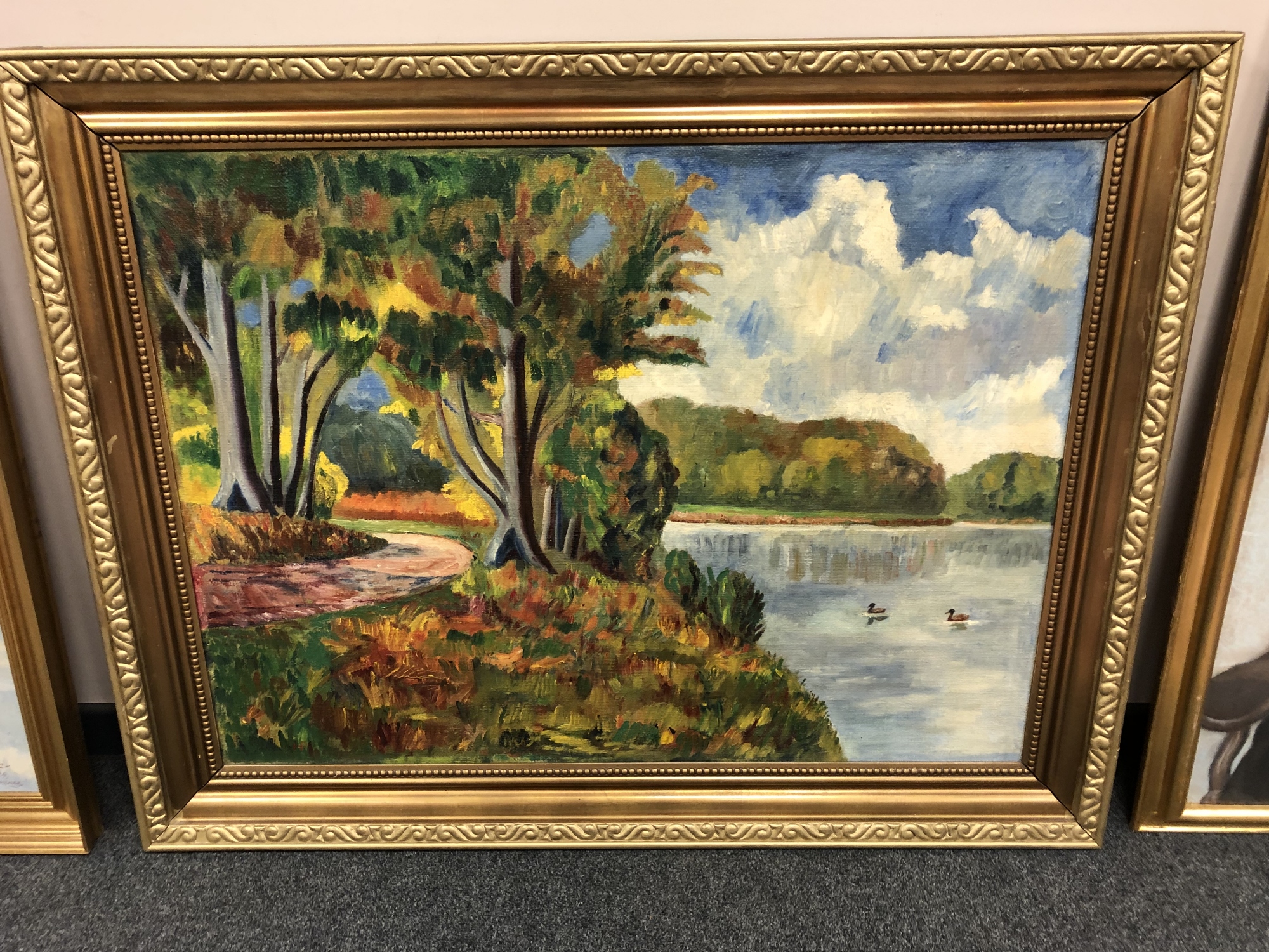 Continental school : Ducks swimming by a track, oil-on-canvas, in gilt frame, 77cm by 105cm.