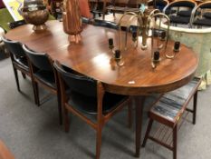A mid century Danish circular extending dining table with two leaves, total length 246 cm,