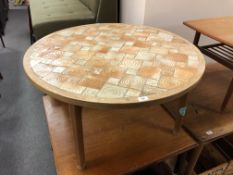 A 20th century Scandinavian circular tile topped coffee table (diameter 96cm).
