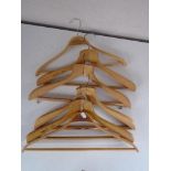 A collection of Orient line and other wooden coat hangers.