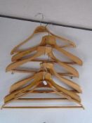 A collection of Orient line and other wooden coat hangers.