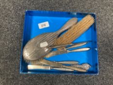 Two silver backed dressing table brushes together with silver handled butter knives and button pull