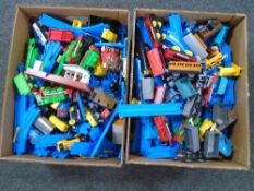 Two boxes containing a large quantity of Tomy Thomas and Friends trains, track and accessories.