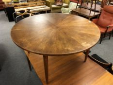 A mid century Danish circular coffee table on tapered legs, diameter 109 cm.