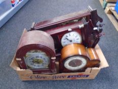 A box containing wall clocks including contemporary bracket clock etc.